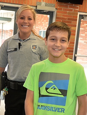 Photo: District Resource Officer Anna Pomeroy and student Lucas