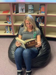 Mrs. Peterson reading a book