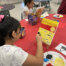 Students painting at La Plaza at Harney Elementary School